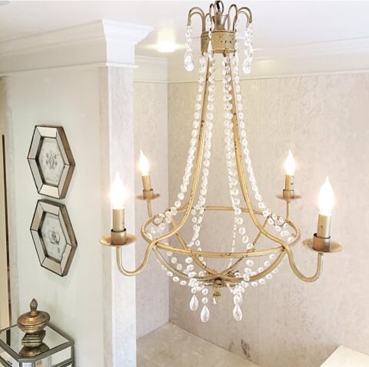 Julie picked this chic chandelier for her master bathroom for added glam.