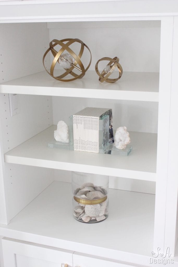 fashion books, fashion coffee table books, style books, blush pink sea glass beads, pineapple ceramic candle, ikea hack shelves, glam style office, decorating with books, styling built-ins shelving