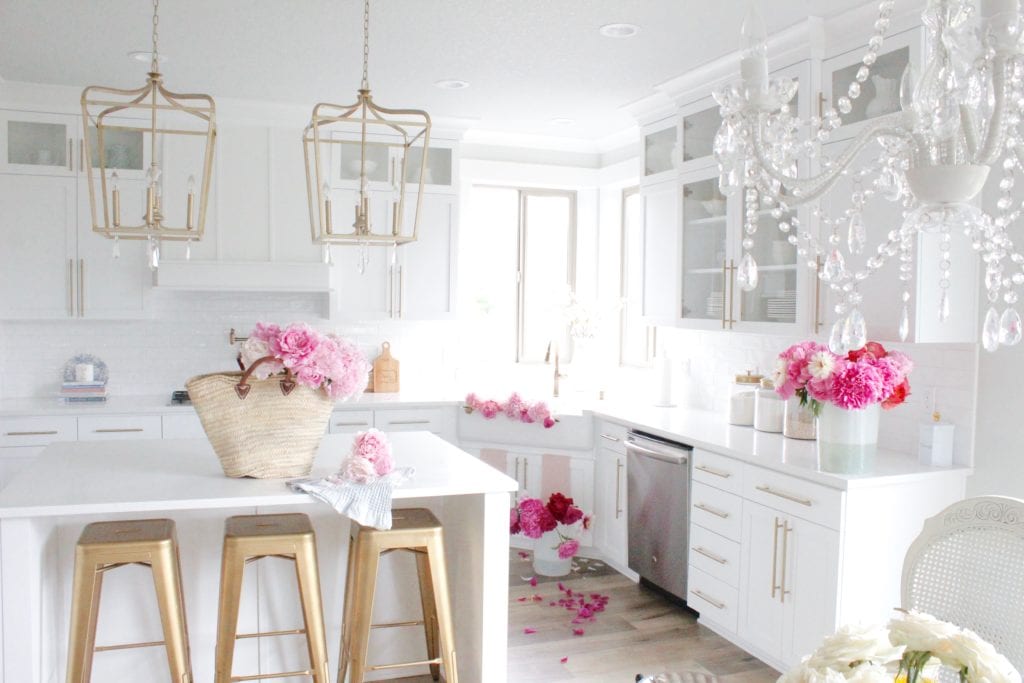 pink peonies in white kitchen