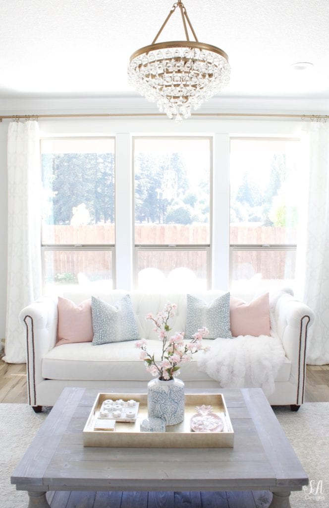 crystorama calypso chandelier, white interiors, white sofa, chesterfield sofa, bright white homes