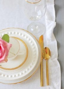 crystal chandelier, crystorama chandelier, white faux pumpkin floral arrangement, romantic floral brunch tablescape, girls table, brunch table, girlfriends party, fall party, fall tablescape, blush pink ruffle dinner linen napkins, white ruffle table runners, gold flatware, white beaded pottery barn dishes, white beaded world market dishes, gold rimmed goblets wine glasses, pink tablescape, pink table decor, place settings, vintage milk glass dinnerware