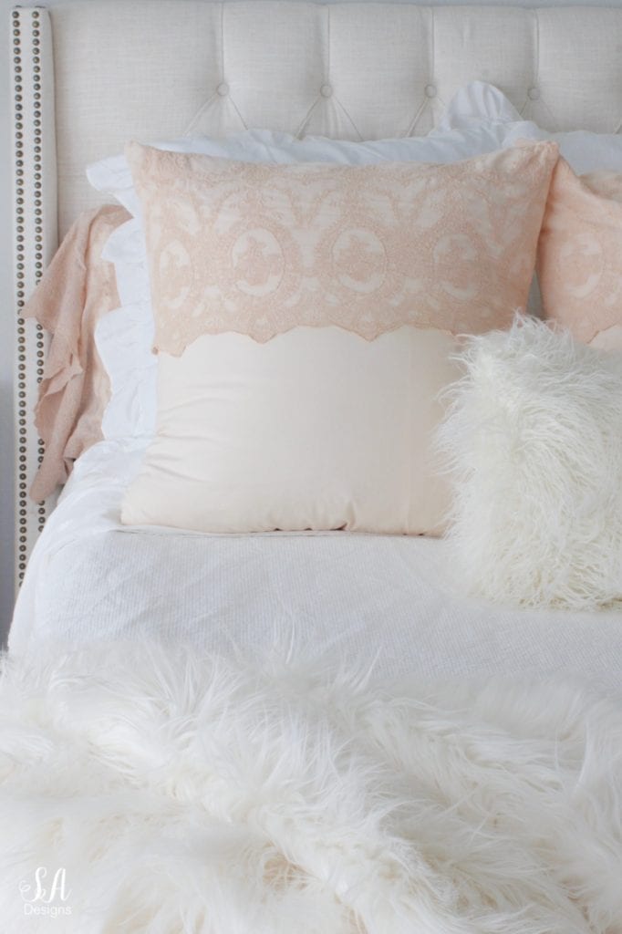 blush pink bedding, pom pom at home, romantic homes, romantic feminine bedroom, faux fur throw blanket, faux fur lumbar oblong pillow, tufted headboard skyline furniture, mirrored bench, chandelier, winter bedding, fall bedding, velvet pumpkins, hotskwash pumpkins, french provincial dresser, french style inspired vanity, agape candles, pink matches, pumpkin candle, fall candle