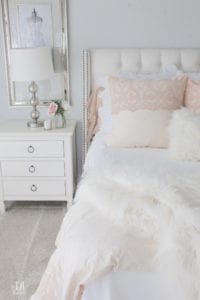 blush pink bedding, pom pom at home, romantic homes, romantic feminine bedroom, faux fur throw blanket, faux fur lumbar oblong pillow, tufted headboard skyline furniture, mirrored bench, chandelier, winter bedding, fall bedding, velvet pumpkins, hotskwash pumpkins, french provincial dresser, french style inspired vanity, agape candles, pink matches, pumpkin candle, fall candle