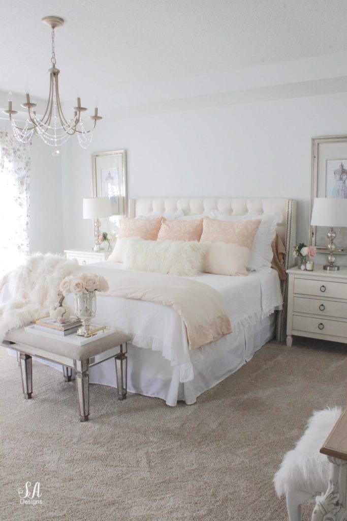 blush pink bedding, pom pom at home, romantic homes, romantic feminine bedroom, faux fur throw blanket, faux fur lumbar oblong pillow, tufted headboard skyline furniture, mirrored bench, chandelier, winter bedding, fall bedding, velvet pumpkins, hotskwash pumpkins, french provincial dresser, french style inspired vanity, agape candles, pink matches, pumpkin candle, fall candle