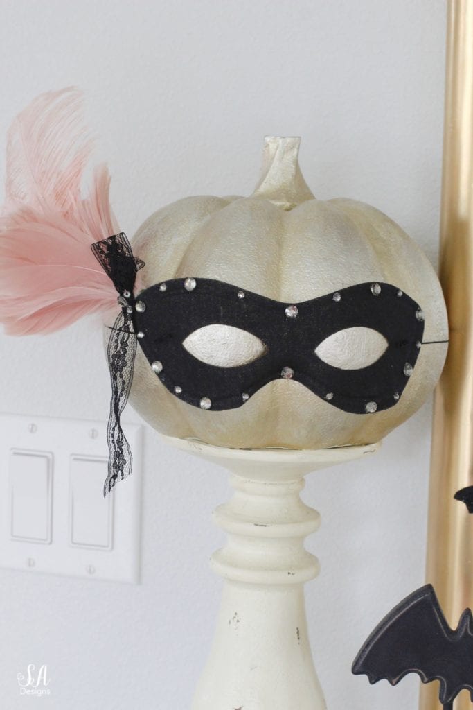 black eye mask, halloween mask, costume mask, blush pink feather joanns, swarovski crystals, diy halloween mask, diy halloween craft, diy mask, glam halloween decor costume, chic halloween decor, elegant halloween decor, blush pink and black masquerade mask