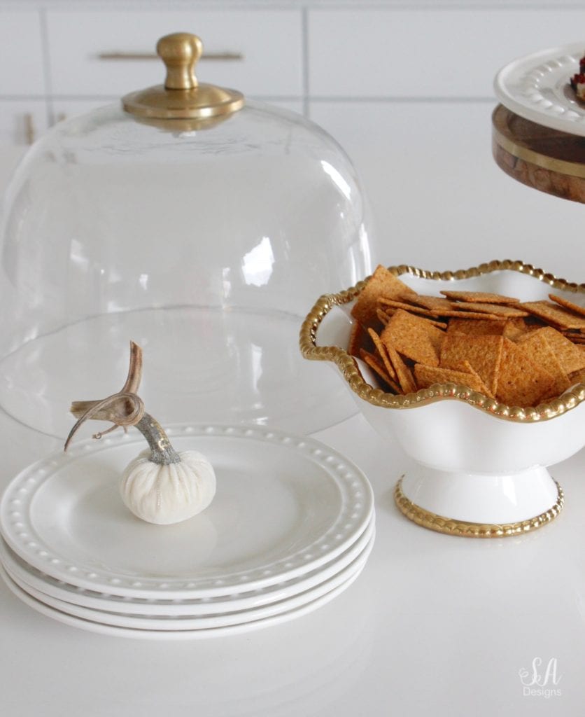 fall recipes, fall appetizers, cheese ball recipe, pink kitchenaid hand mixer, pink kitchenaid mixing bowls, white kitchen, brass pendant lights with crystals, wood and brass cake stand with dome, white dishes, white pumpkins, white interiors