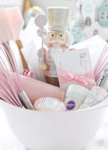 pink gift basket, kitchen utensil gift basket, diy gift ideas, pink christmas, pink kitchenaid, pink mixing bowls, pink kitchen utensils, diy recipe cards, pink recipe cards, pink nutcracker, pink rolling pin, pink whisk, pink measuring spoons, pink macaron candle, voluspa candle, gift ideas for her