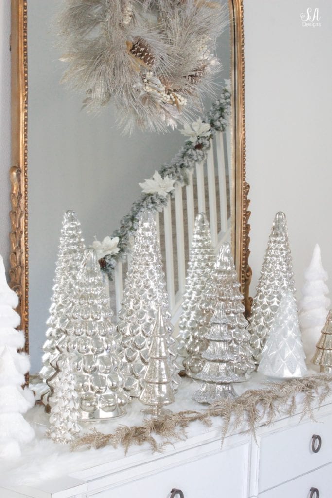 pottery barn mercury glass trees, anthropologie gleaming primrose glass mirror, elegant mixed metal decor