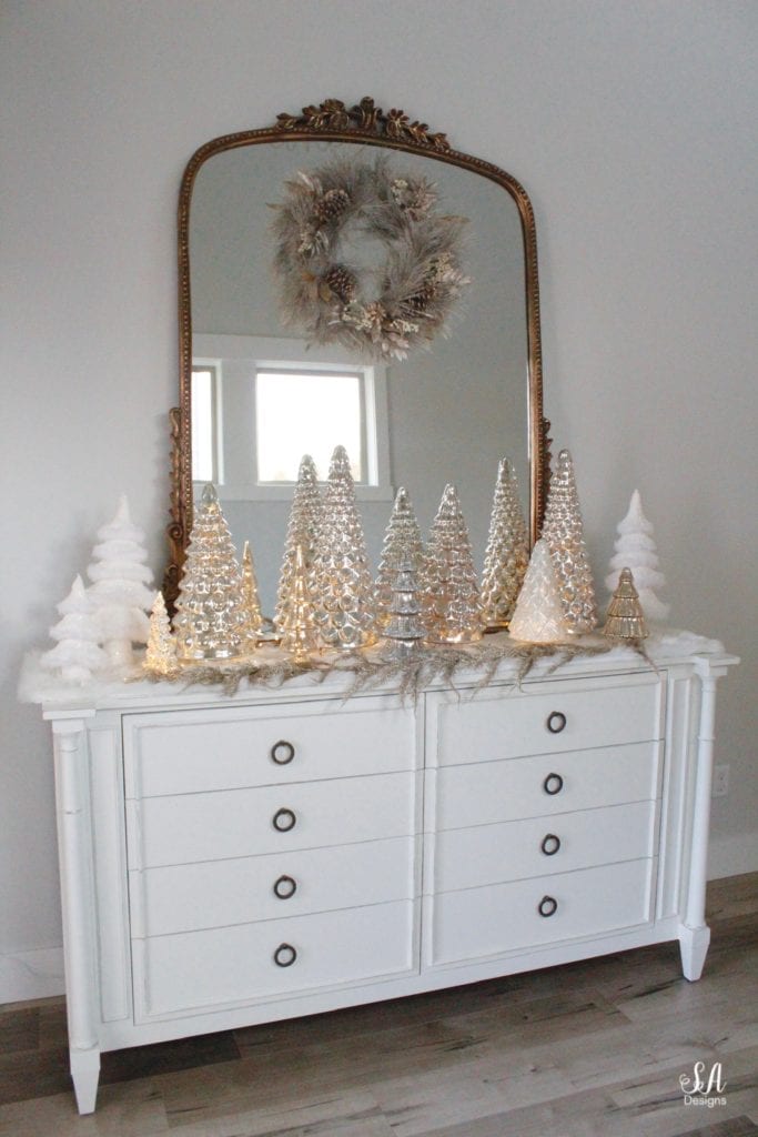 pottery barn mercury glass trees, anthropologie gleaming primrose glass mirror, elegant mixed metal decor, gold wreath, perigold dresser entry buffet table white transitional style buffet