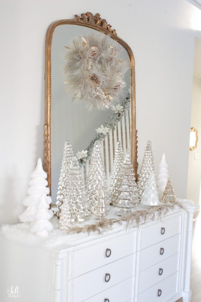 pottery barn mercury glass trees, anthropologie gleaming primrose glass mirror, elegant mixed metal decor