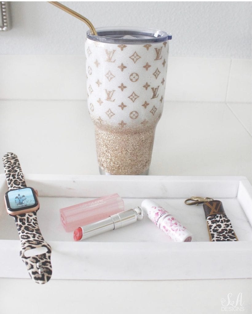 iwatch apple watch with amazon leopard print band, mac lipstick ysl lipstick, louis vuitton leather upcycled keychain