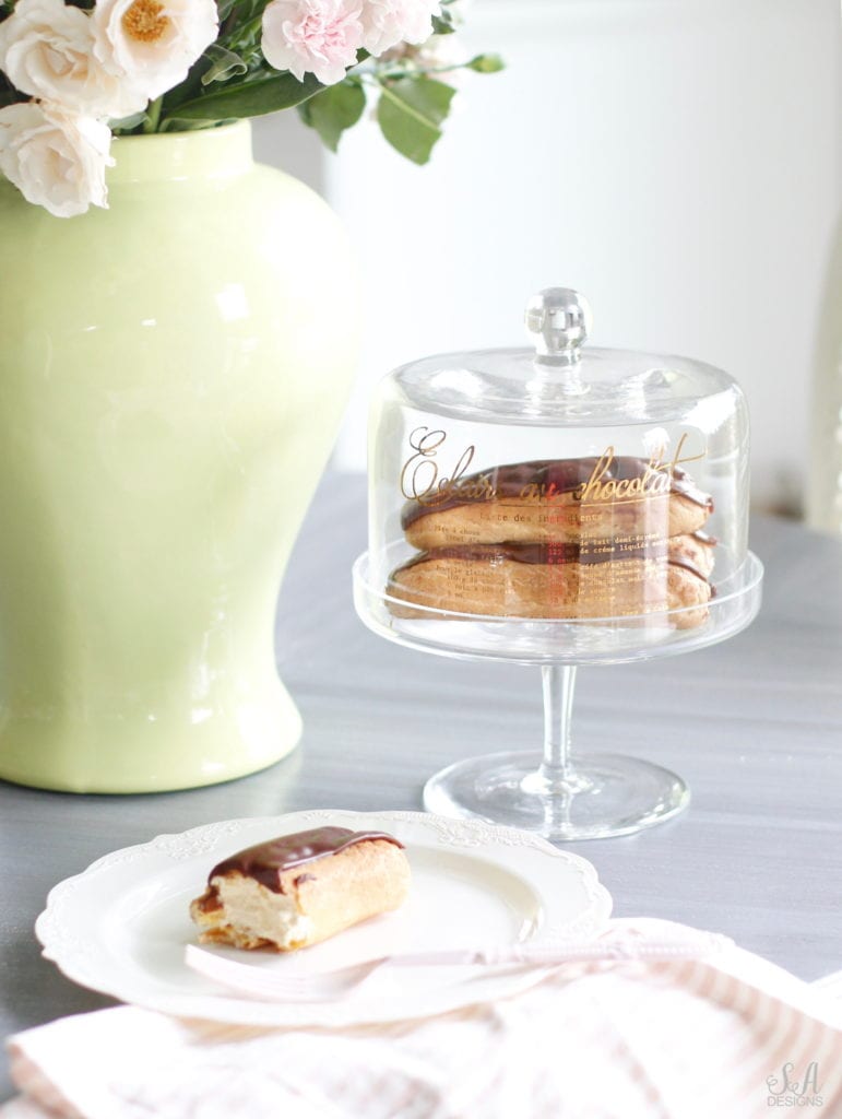 Mothers Day Gift Basket Idea HomeGoods, Elegant Dessert Cake Stand Flowers Gift Basket Idea Mothers Day, Chocolate Eclairs, green ginger jar, disposable vintage plates, striped linen pink napkins