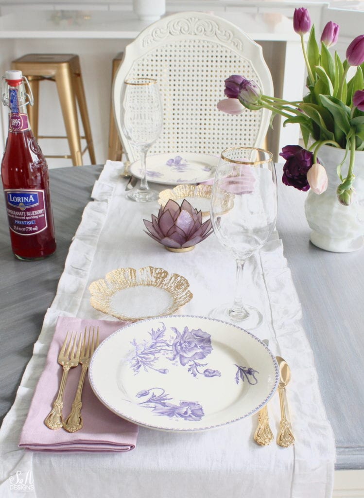 summer tablescape, spring tablescape, purple tablescape, purple tulips arrangement, purple lavender tulips, purple double peony tulips, double tulip peonies, antique french lavender transferware plates, paris france flea market find, gold flatware, purple orchid dinner napkins world market, gold rimmed crystal goblets, purple petal lotus capiz tea light holder world market, white ruffle linen table runners, crystorama clear crystal chandelier, anthropologie mauve lavender blouse top, white kitchen design, pacific northwest interior designer blogger fashion blogger summer adams designs, white milkglass vase