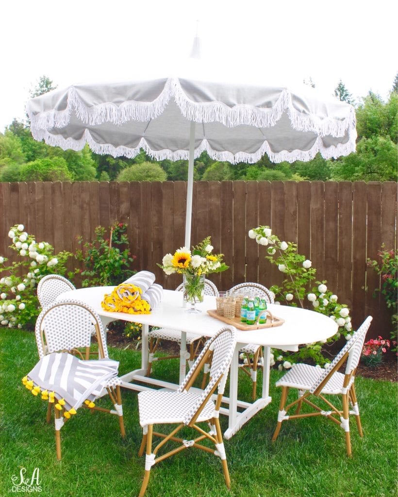 serena and lily outdoor umbrella grey with white fringe