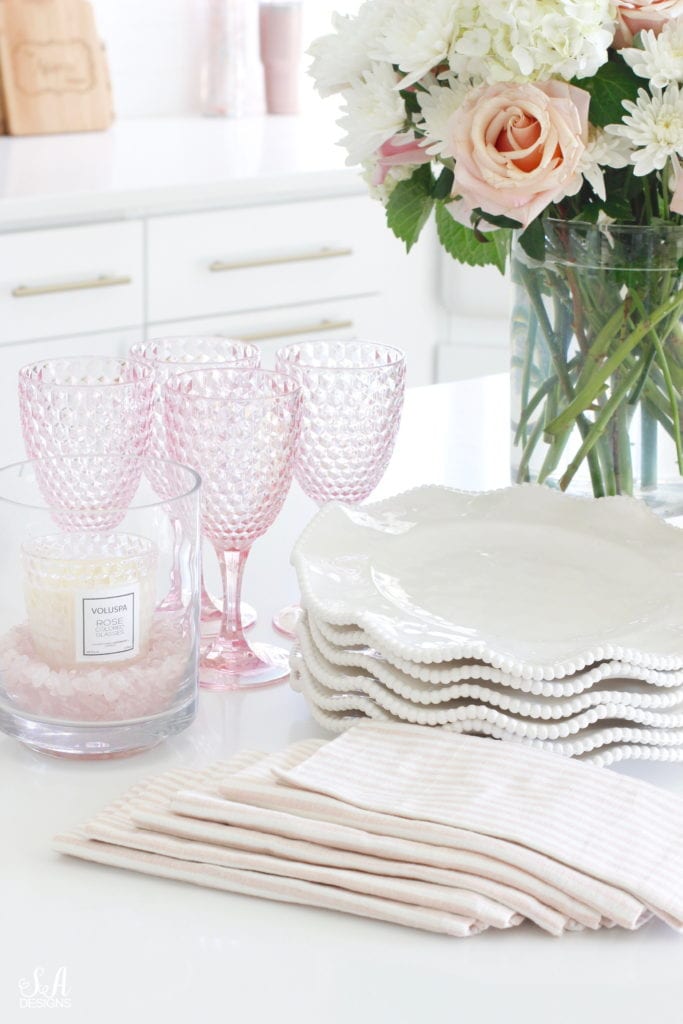 wayfair ruffle beaded white melamine plates, pink melamine goblets homegoods, voluspa candles, pink ticking napkins