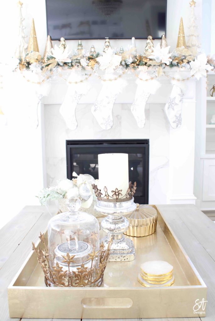 white and gold elegant glam Christmas decor, Christmas coffee table, ornaments in ZGallerie beaded pedestal bowl with ribbon, terrain Anthropologie Santos crowns, crowns on candlesticks, mercury glass candlesticks, Christmas coffee table