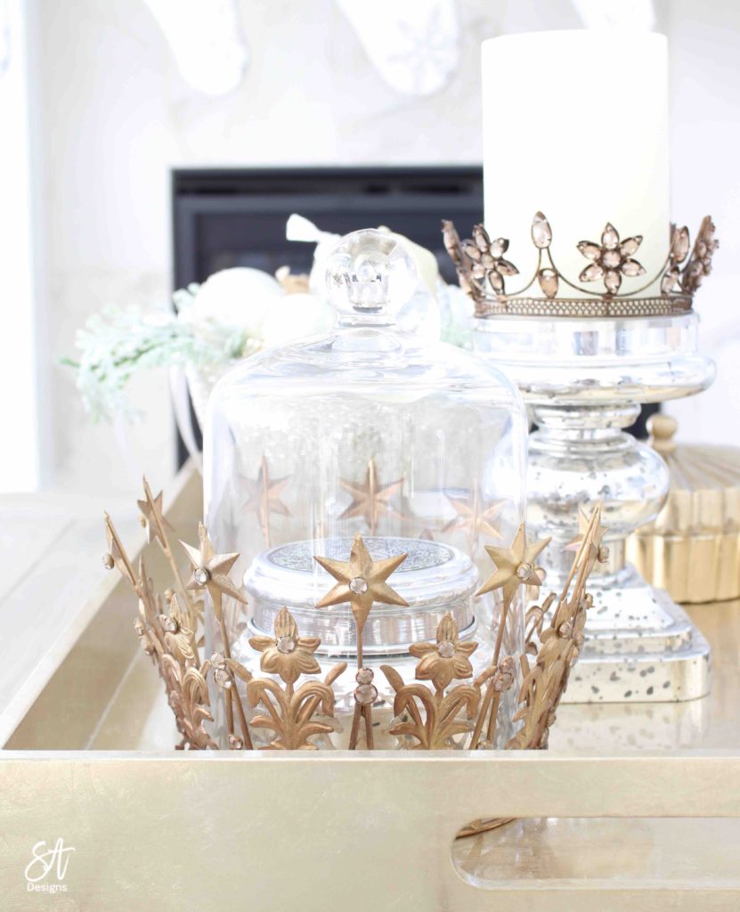 white and gold elegant glam Christmas decor, Christmas coffee table, ornaments in ZGallerie beaded pedestal bowl with ribbon, terrain Anthropologie Santos crowns, crowns on candlesticks, mercury glass candlesticks, Christmas coffee table