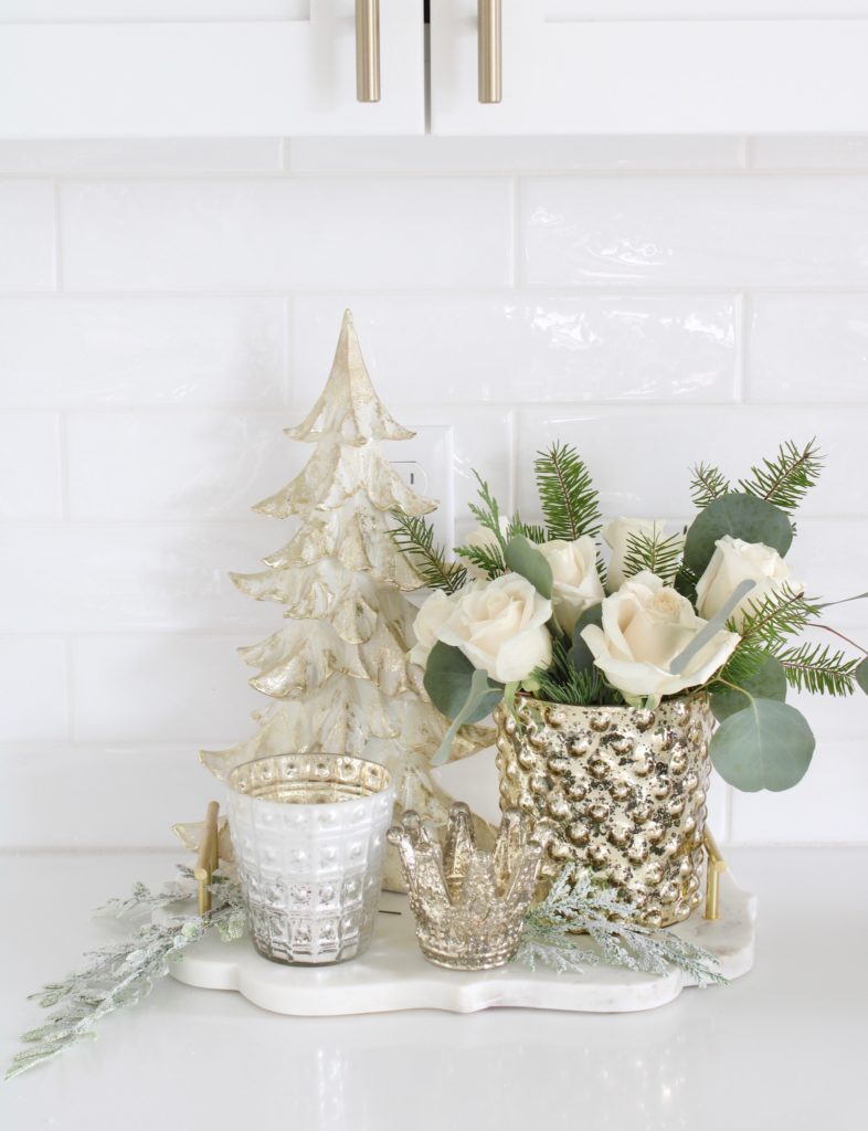 white and gold Christmas kitchen, glam Christmas kitchen, ribbon bows on kitchen pendants lighting, Christmas bows on kitchen lights, elegant Christmas kitchen, classy Christmas kitchen decorating, d. Stevens white and gold rhinestone Christmas ribbon, specialty white velvet gold rhinestone wired edge ribbon, gold barstools, Christmas floral arrangements, white and gold Christmas wreath, white kitchen design, white Christmas decor, white and gold Christmas kitchen decor