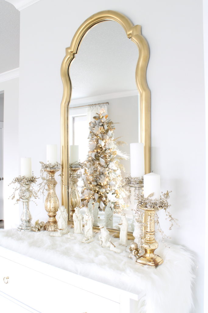 white and gold Christmas buffet, white and gold nativity creche, gold tall mirror,