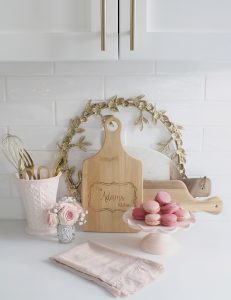 pink cookbooks, pink heart-shaped baking dishes, diptyque candles with flowers, pink macarons,Voluspa candles, Voluspa 123 oz rose candle, valentines diy fresh flowers arrangement at home, classy Valentine's Day decor, elegant Valentine's decor, soft romantic pink Valentine's Day decor, glam Valentine's decorations, classy elegant glam Valentine's pennant banner garland, Valentine's flower arrangements, pink ginger jars, Valentine's candy bar buffet, Valentine's cocoa hot chocolate bar, Valentine's bar cart, Valentine's living room decor, Valentine's entry way decor, classy glam elegant Valentine's Day decorating ideas, white kitchen decorated for Valentine's Day, elegant Valentine's tablescapes, gold mirrored tray, gold sequin heart banner, mercury glass votives pottery barn, ruffle cake stand, voluspa macaron candles, milk glass pedestal bowls
