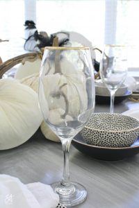walmart dinnerware, affordable dinnerware, glam modern dinnerware, modern place settings, velvet pumpkins, black and white halloween table, white cloth dinner napkin, gold jewel spider napkin ring, halloween napkin ring