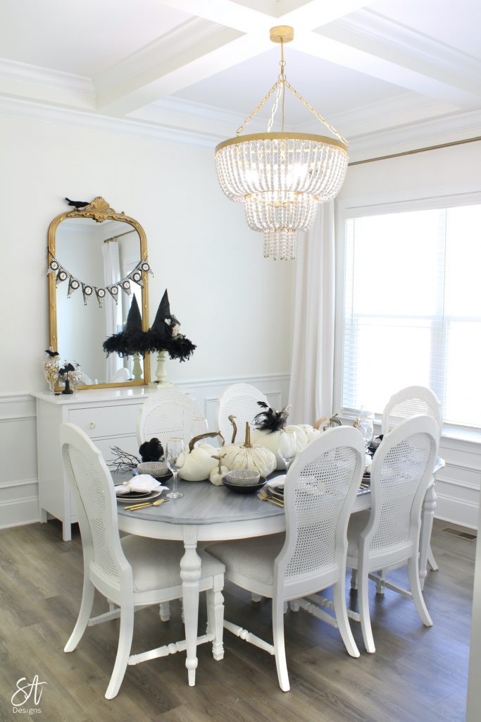 halloween table, black and white dinnerware, black and white place settings, halloween tablescape, black and white glam halloween table, classy halloween table, walmart dinnerware, affordable dinnerware, large gold ornate wall mirror, white and gold decor, white and gold dining room, classy dining room, glam dining room