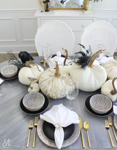 walmart dinnerware, affordable dinnerware, glam modern dinnerware, modern place settings, velvet pumpkins, black and white halloween table, white cloth dinner napkin, gold jewel spider napkin ring, halloween napkin rings, gold flatware, clear goblets gold rimmed