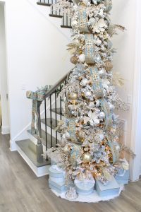astoria grand lipscomb 24-light candle style tiered chandelier with crystal accents, gold brass large chandelier for entry, gold round chandelier, how to hang garland on staircase banister