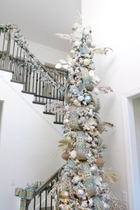 astoria grand lipscomb 24-light candle style tiered chandelier with crystal accents, gold brass large chandelier for entry, gold round chandelier, how to hang garland on staircase banister
