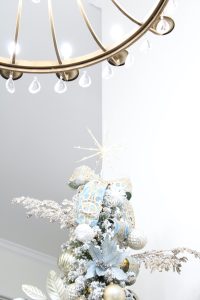 astoria grand lipscomb 24-light candle style tiered chandelier with crystal accents, gold brass large chandelier for entry, gold round chandelier, how to hang garland on staircase banister