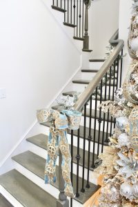 how to hang garland on staircase banister