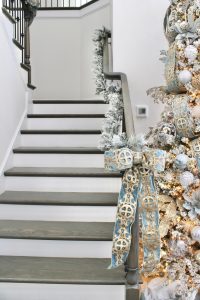 how to hang garland on staircase banister