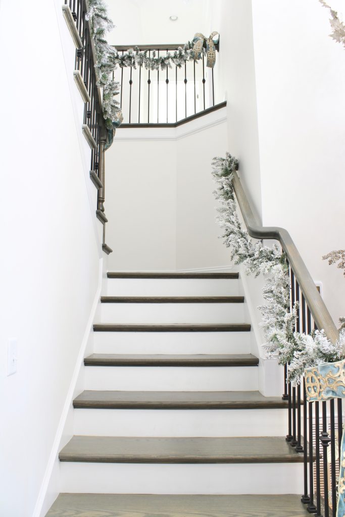 how to hang garland on staircase banister