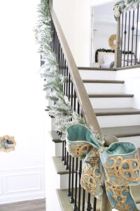 how to hang garland on staircase banister