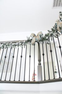 how to hang garland on staircase banister