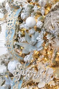ornate aqua spa blue 2.5" wired ribbon, designer christmas tree ribbon, designer christmas tree, glam christmas tree, blogger influencer christmas tree design, how to place ribbon on christmas tree, flocked christmas tree, 12' christmas tree, entry way christmas design, christmas inspiration, sugar paper target christmas wrap boxes, pottery barn mercury glass christmas trees, anthropologie gleaming primrose 5' mirror, christmas entry inspo decorating, glam christmas