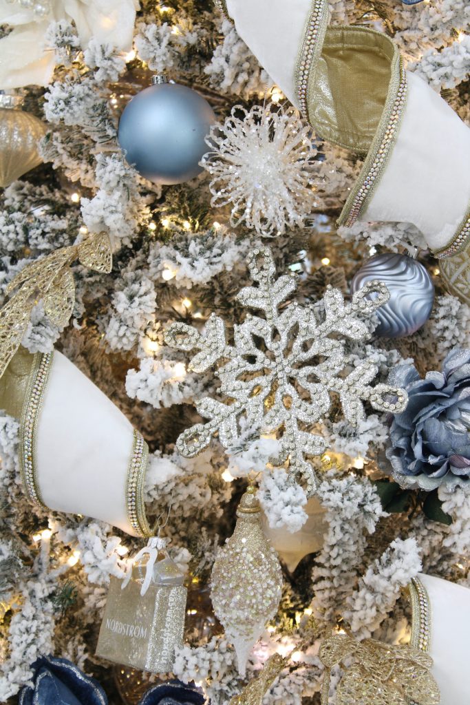 snowflake sparkly ornaments,white and gold decor, glam christmas, white walls, ginger jars, classy christmas, christmas blogger tour, white sofas, custom pillow covers, flocked christmas tree, flocked garland christmas mantel