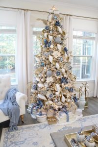 white and gold decor, glam christmas, white walls, ginger jars, classy christmas, christmas blogger tour, white sofas, custom pillow covers, flocked christmas tree, flocked garland christmas mantel