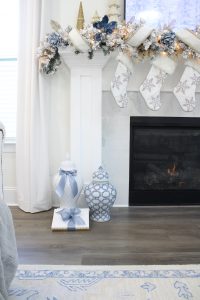 white and gold decor, glam christmas, white walls, ginger jars, classy christmas, christmas blogger tour, white sofas, custom pillow covers, flocked christmas tree, flocked garland christmas mantel
