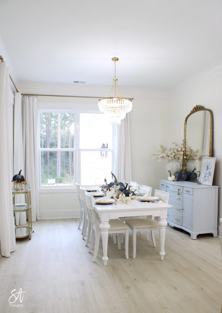 elegant fall dining room, elegant table settings for fall, blue velvet hot skwash pumpkins, elegant fall foliage stems